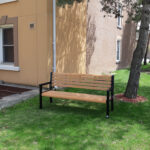 a memorial recycled plastic park bench and garden bench in the garden