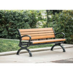 classic recycled plastic wood garden and park bench on a quiet community sidewalk. It's a classic memorial bench too