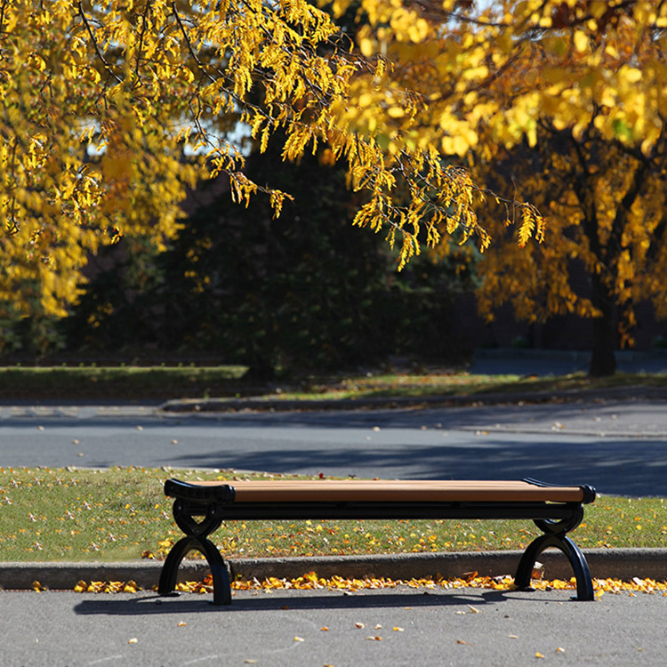 recycled plastic backless park bench is a wonderful match to the golden leaves