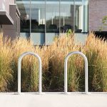 commercial outdoor bike racks for parking are placed at a community library