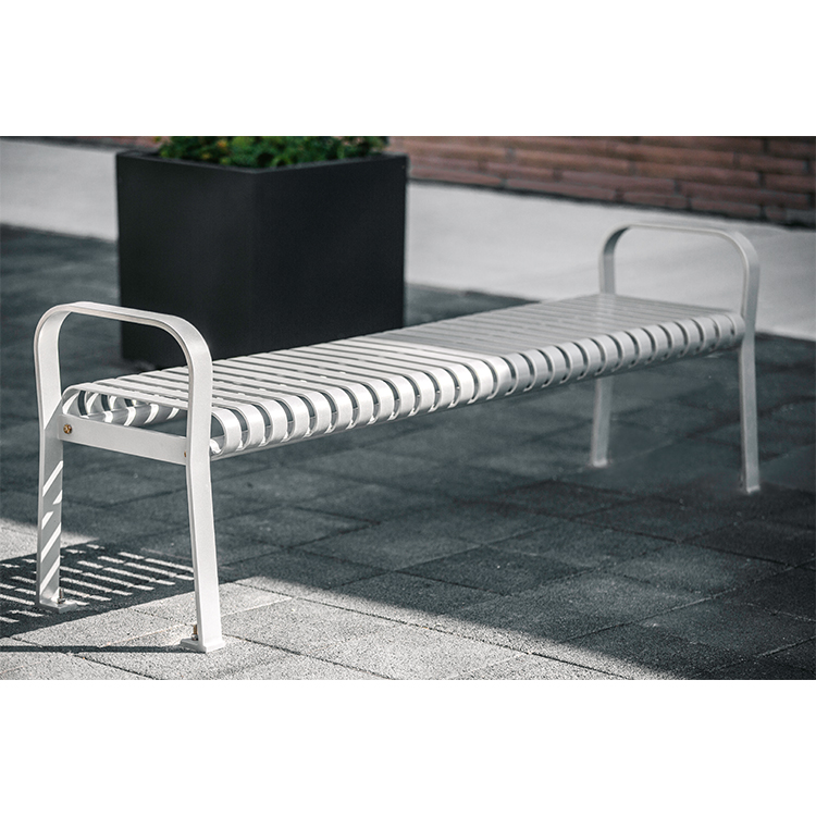 silver white backless metal garden and park bench looks great at a contemporary style office site