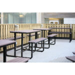 recycled plastic made traditional designed park picnic tables on campus outside cafeteria