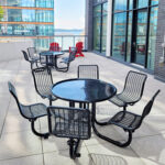 outdoor commercial patio tables are in the patio of a office building in downtown Toronto