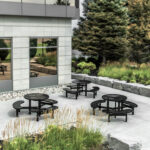 black steel outdoor commercial park picnic tables in an urban business setting