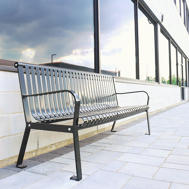 black steel park and garden bench and the cloud reflection in the window create a beautiful workplace afternoon scene