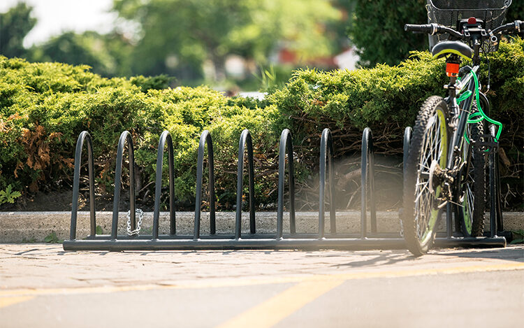 powder coated steel bike rack in a community park